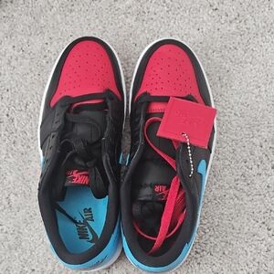 Nike Air Black and Red Sneakers with Blue Accents